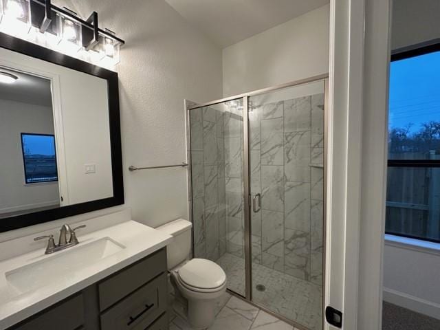 9015 Orchard Cv, Missouri City, TX 77459 - full bath with toilet, a shower stall, marble finish floor, and vanity