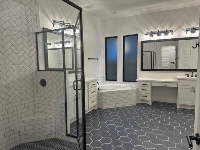 9015 Orchard Cv, Missouri City, TX 77459 - bathroom featuring a shower stall, a garden tub, vanity, and tile patterned flooring