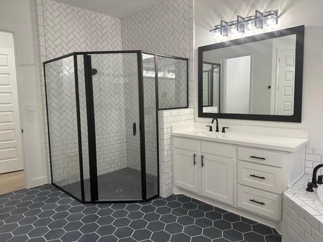 9015 Orchard Cv, Missouri City, TX 77459 - full bath with a bath, a stall shower, and tile patterned floors