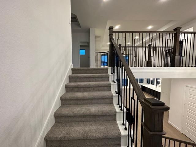 9015 Orchard Cv, Missouri City, TX 77459 - stairs with recessed lighting
