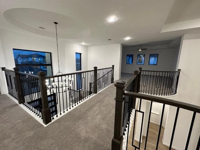 9015 Orchard Cv, Missouri City, TX 77459 - hallway featuring carpet flooring, an upstairs landing, and recessed lighting
