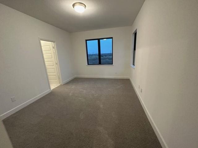 9015 Orchard Cv, Missouri City, TX 77459 - unfurnished room with dark carpet and baseboards