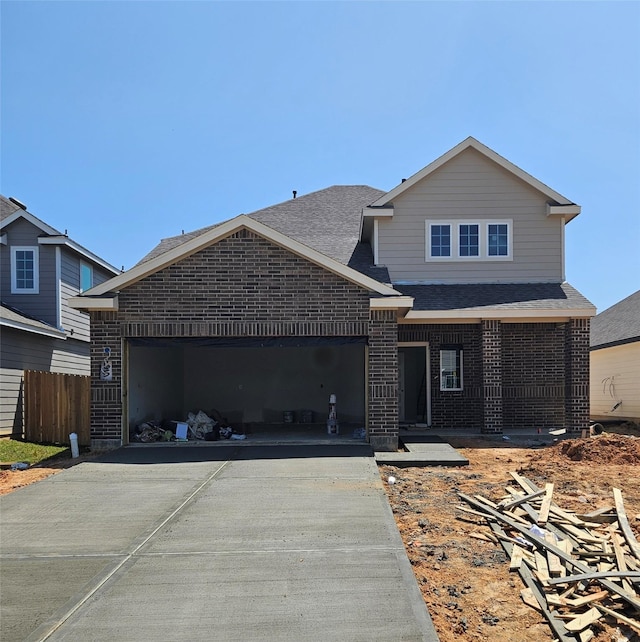 16543 Willow Forest Dr, Conroe, TX 77302 - view of front facade featuring fence, a shingled roof, a garage, and driveway