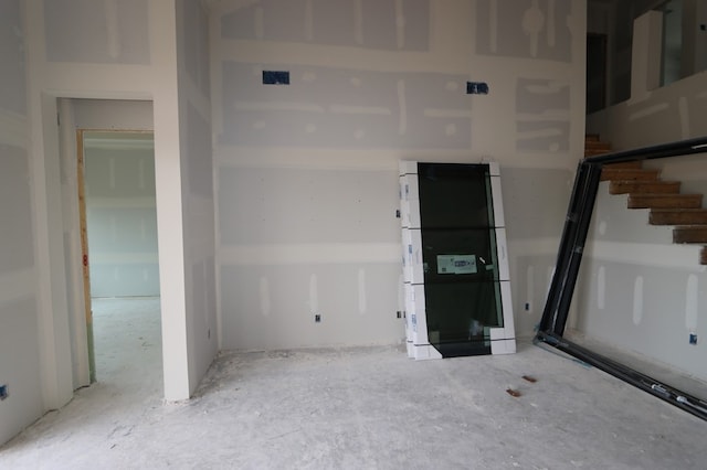 16146 Rita Rd, Conroe, TX 77302 - basement featuring stairs and freestanding refrigerator