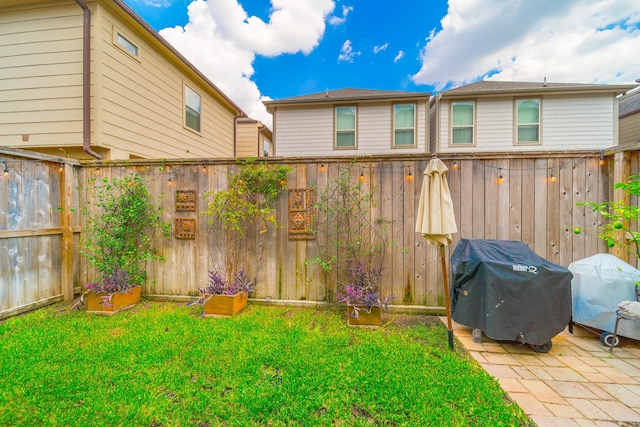 view of yard with a fenced backyard