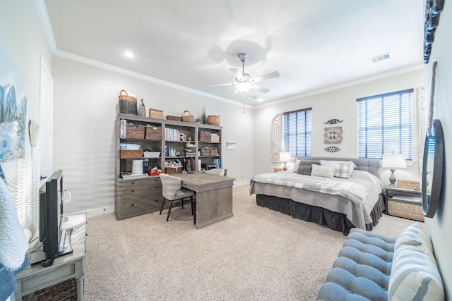 carpeted bedroom featuring visible vents, ceiling fan, crown molding, and baseboards