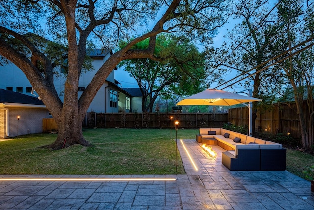 view of yard featuring an outdoor living space, a patio, and a fenced backyard