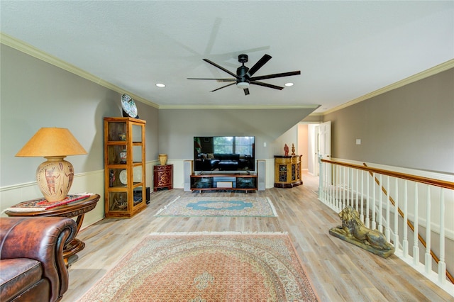 16123 Chasemore Dr, Spring, TX 77379 - living room featuring a ceiling fan, wood finished floors, crown molding, recessed lighting, and wainscoting