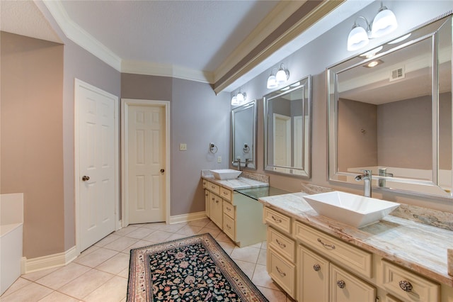 16123 Chasemore Dr, Spring, TX 77379 - full bath with two vanities, tile patterned flooring, baseboards, and ornamental molding