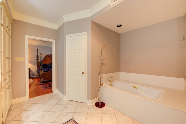 16123 Chasemore Dr, Spring, TX 77379 - full bath featuring a garden tub, tile patterned floors, crown molding, and baseboards