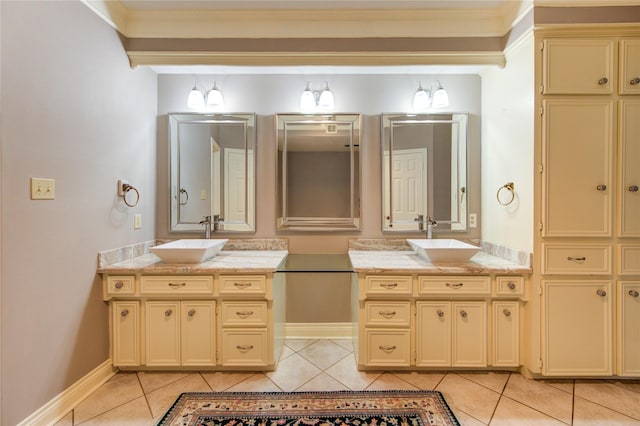 16123 Chasemore Dr, Spring, TX 77379 - bathroom with tile patterned flooring, two vanities, and baseboards