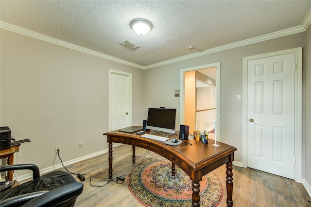 16123 Chasemore Dr, Spring, TX 77379 - office area with ornamental molding, light wood-type flooring, baseboards, and a textured ceiling