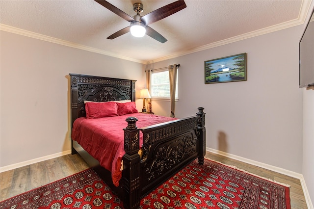 16123 Chasemore Dr, Spring, TX 77379 - bedroom with wood finished floors, crown molding, baseboards, a textured ceiling, and ceiling fan
