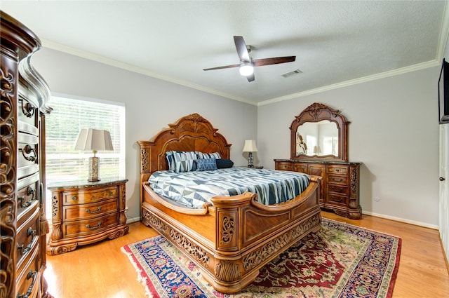 16123 Chasemore Dr, Spring, TX 77379 - bedroom featuring light wood-type flooring, crown molding, ceiling fan, and baseboards
