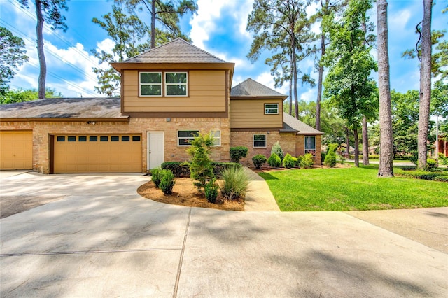 16123 Chasemore Dr, Spring, TX 77379 - traditional-style home with concrete driveway, brick siding, a front lawn, and an attached garage