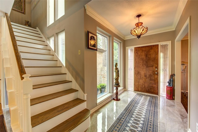 16123 Chasemore Dr, Spring, TX 77379 - entrance foyer featuring stairway, ornamental molding, marble tiled flooring, a chandelier, and baseboards