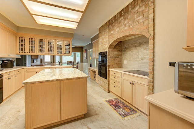 16123 Chasemore Dr, Spring, TX 77379 - kitchen with black appliances, backsplash, a kitchen island, glass insert cabinets, and a fireplace