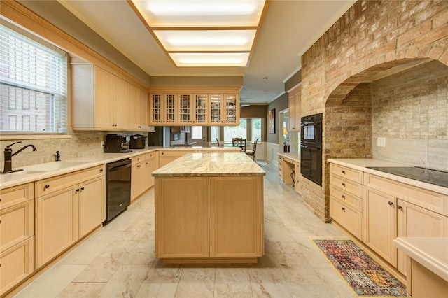 16123 Chasemore Dr, Spring, TX 77379 - kitchen with a kitchen island, black appliances, a sink, glass insert cabinets, and tasteful backsplash
