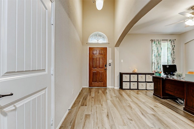2011 Wembley Way, Rosenberg, TX 77471 - entrance foyer featuring arched walkways, a ceiling fan, a wealth of natural light, and light wood-style floors