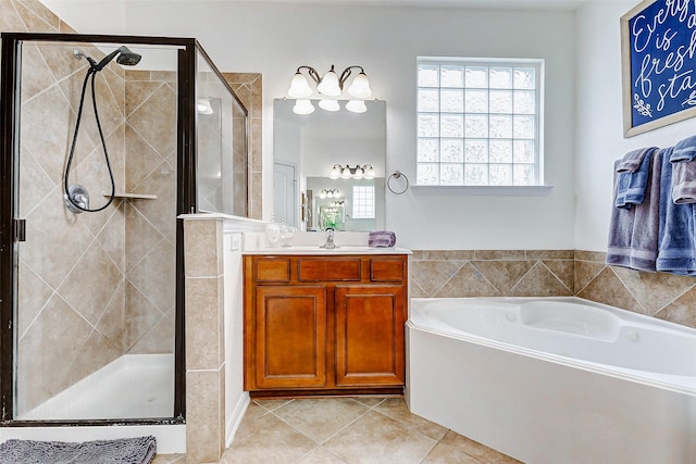 2011 Wembley Way, Rosenberg, TX 77471 - bathroom featuring tile patterned flooring, vanity, a shower stall, a healthy amount of sunlight, and a bath