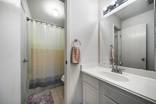 bathroom featuring visible vents, tile patterned flooring, vanity, and toilet