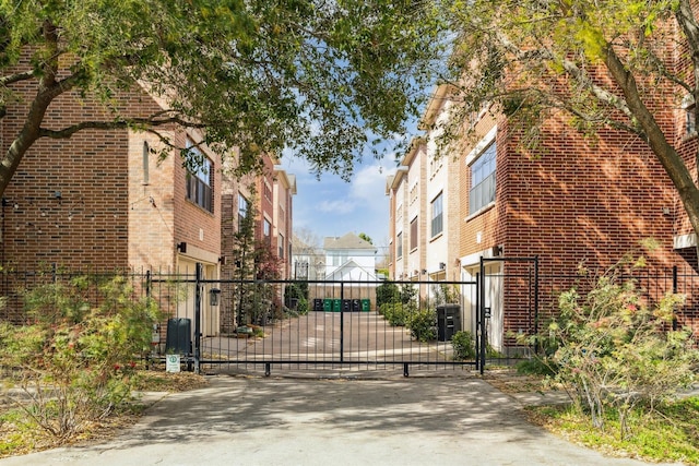 view of gate featuring fence