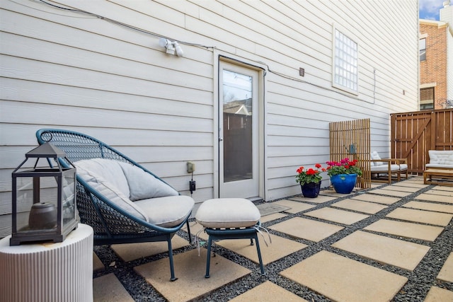 view of patio featuring fence