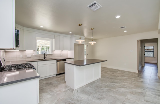 624 Willow Ln, Eagle Lake, TX 77434 - kitchen featuring dishwasher, a sink, dark countertops, decorative backsplash, and stove