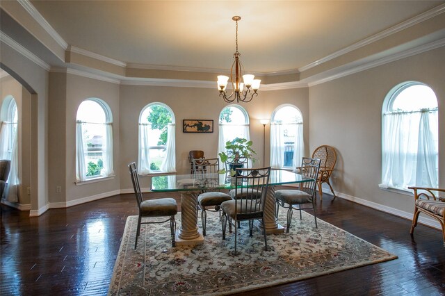 dining room with arched walkways, a notable chandelier, dark wood-style flooring, and ornamental molding