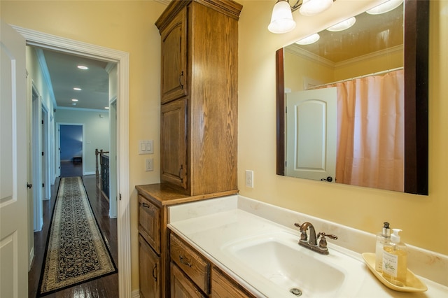 full bath featuring vanity and ornamental molding