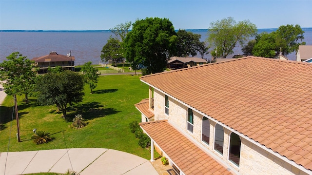 birds eye view of property featuring a water view