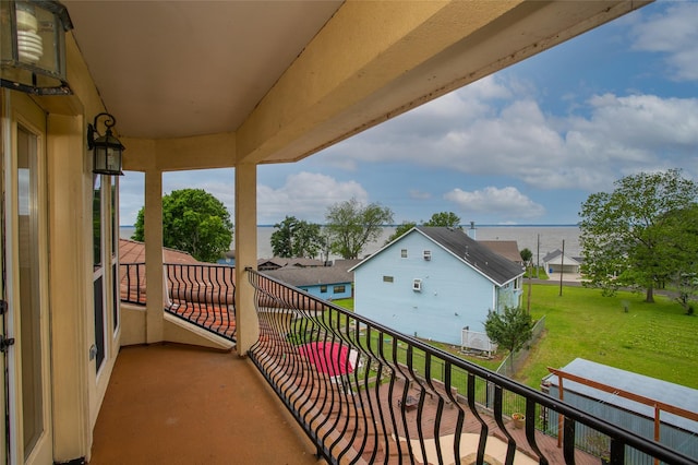 balcony featuring a water view