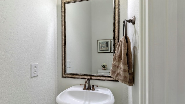 331 Old Aqua Lndg, Montgomery, TX 77356 - bathroom with a textured wall and a sink