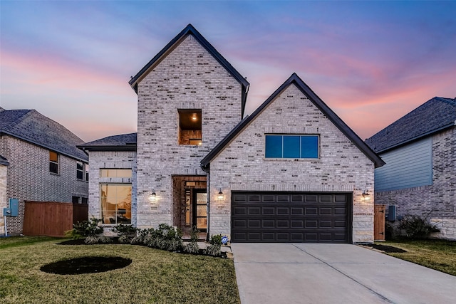 21123 Coral View Dr, Cypress, TX 77433 - french country home with a yard, an attached garage, fence, brick siding, and driveway