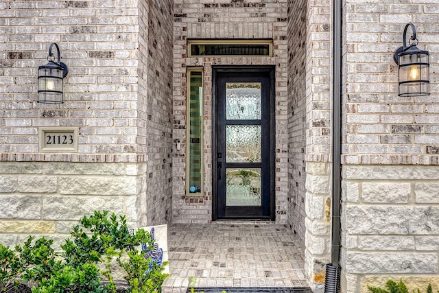 21123 Coral View Dr, Cypress, TX 77433 - view of exterior entry featuring stone siding