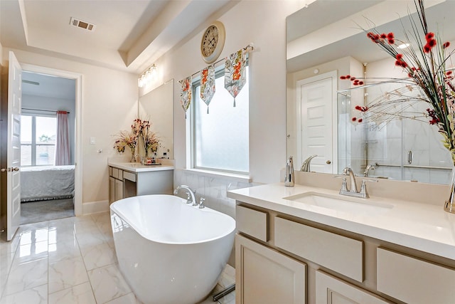 21123 Coral View Dr, Cypress, TX 77433 - bathroom featuring a freestanding bath, marble finish floor, ensuite bath, and plenty of natural light