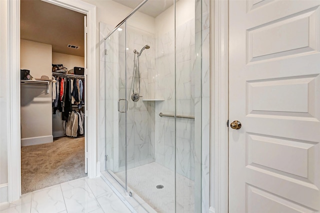 21123 Coral View Dr, Cypress, TX 77433 - bathroom with visible vents, baseboards, a spacious closet, a marble finish shower, and marble finish floor