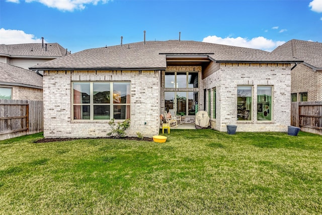 21123 Coral View Dr, Cypress, TX 77433 - rear view of property featuring a yard, a fenced backyard, roof with shingles, and a patio area