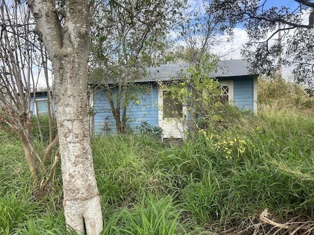 view of home's exterior with metal roof