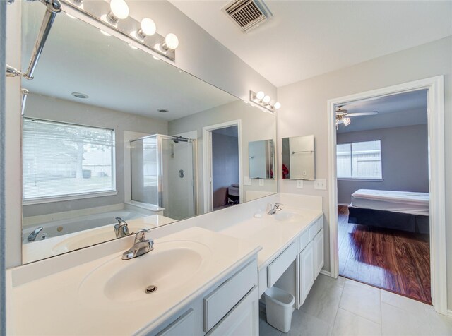 1311 Holly Lake Ct, Katy, TX 77450 - full bathroom with visible vents, a stall shower, a sink, and connected bathroom