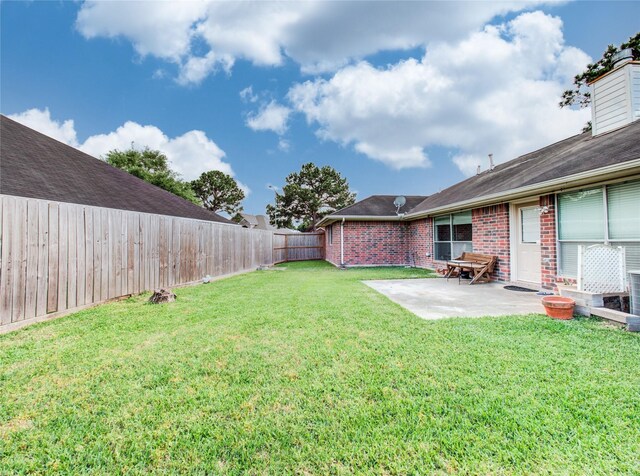 1311 Holly Lake Ct, Katy, TX 77450 - view of yard with a fenced backyard and a patio