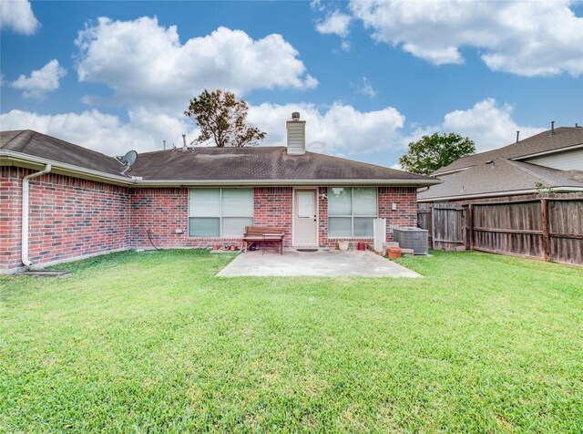 1311 Holly Lake Ct, Katy, TX 77450 - rear view of property featuring brick siding, a patio area, a chimney, and fence