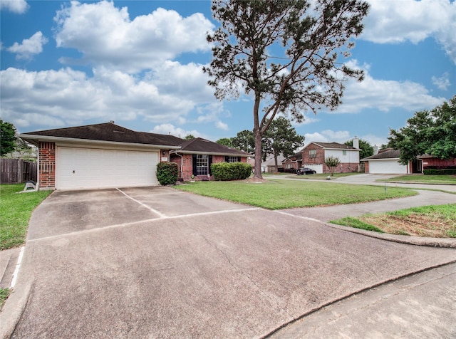 1311 Holly Lake Ct, Katy, TX 77450 - single story home featuring concrete driveway, fence, brick siding, an attached garage, and a front yard