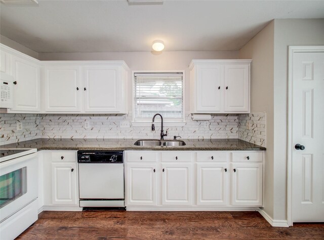 1311 Holly Lake Ct, Katy, TX 77450 - kitchen with dark stone counters, white cabinetry, a sink, and white appliances