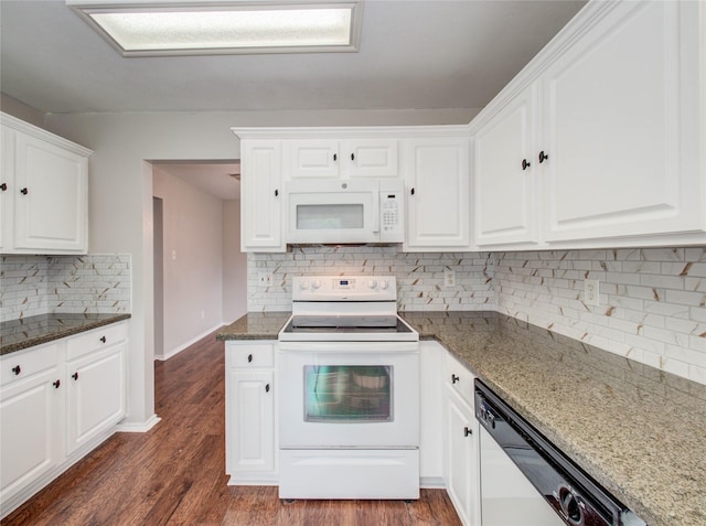 1311 Holly Lake Ct, Katy, TX 77450 - kitchen featuring white cabinets, dark stone countertops, decorative backsplash, and white appliances