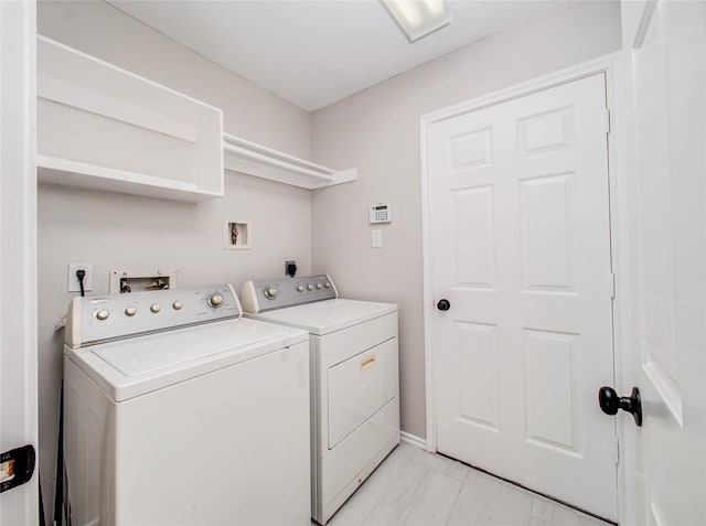 1311 Holly Lake Ct, Katy, TX 77450 - washroom featuring marble finish floor, washer and clothes dryer, and laundry area