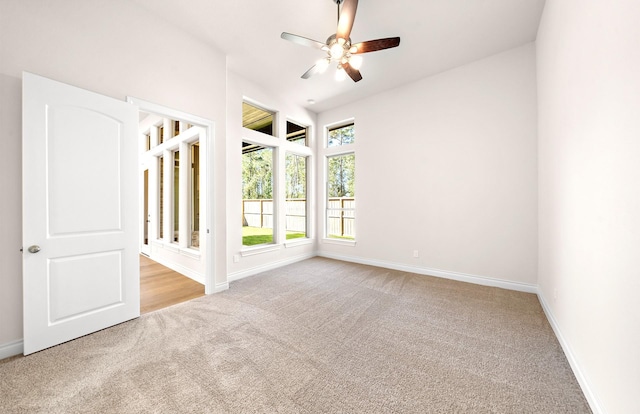 8215 Mount Washburn Ln, Porter, TX 77365 - carpeted spare room with baseboards and a ceiling fan