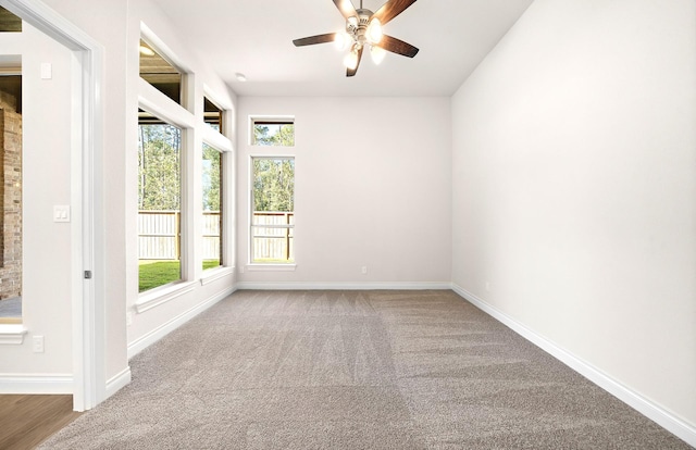 8215 Mount Washburn Ln, Porter, TX 77365 - unfurnished room featuring carpet floors, baseboards, and a ceiling fan
