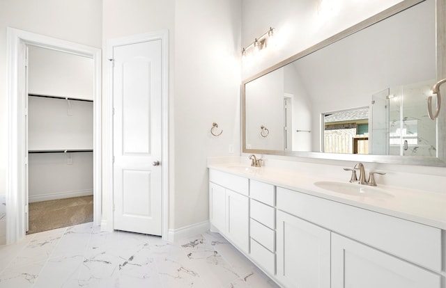 8215 Mount Washburn Ln, Porter, TX 77365 - bathroom featuring double vanity, marble finish floor, a sink, and baseboards