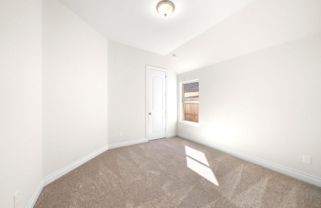 8215 Mount Washburn Ln, Porter, TX 77365 - unfurnished room featuring baseboards, carpet, and vaulted ceiling